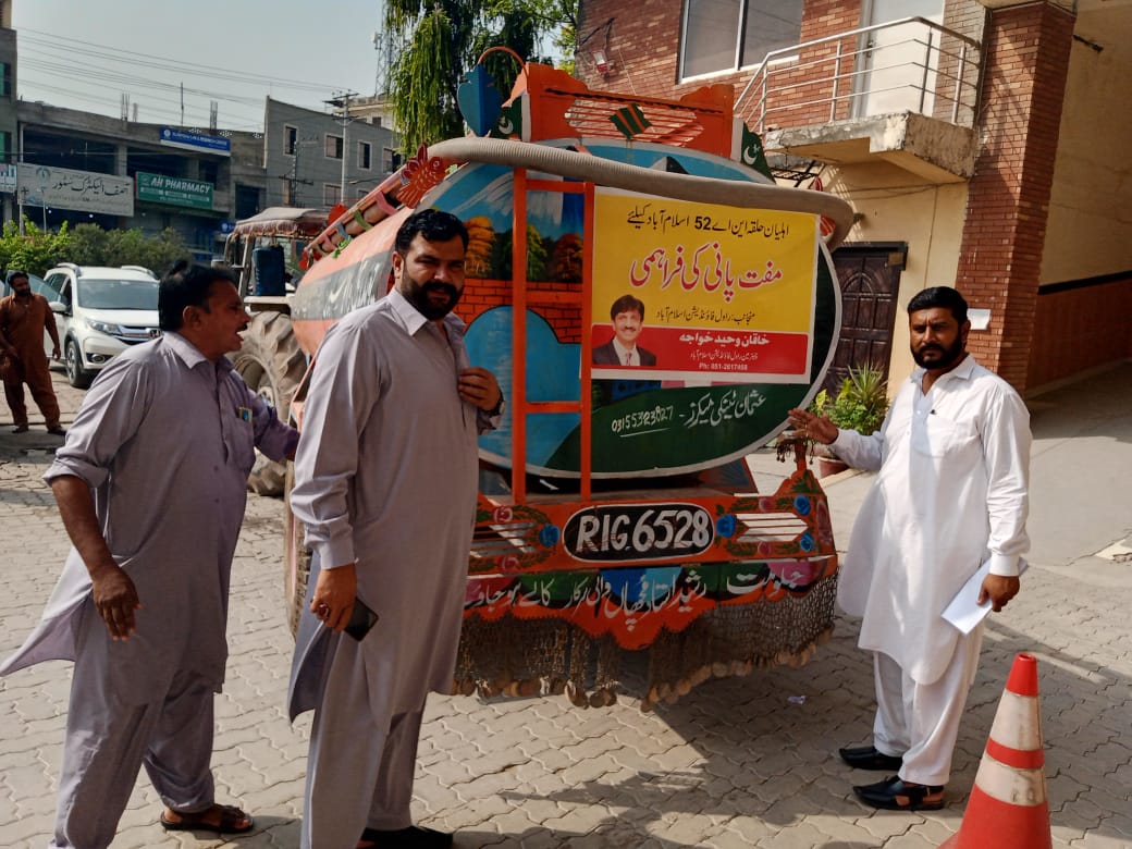Community members receiving clean water assistance