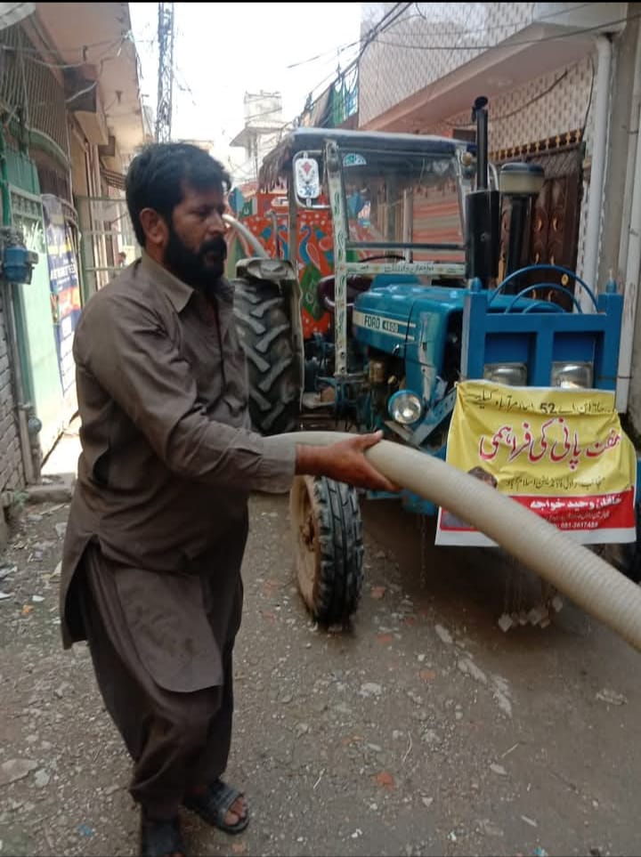 Community members receiving clean water assistance